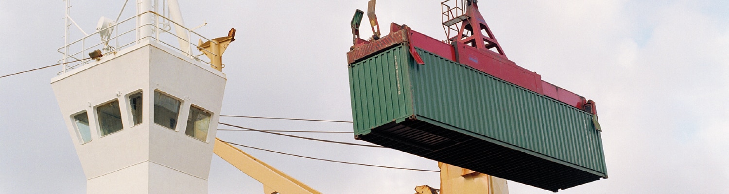 Crane moving shipping container